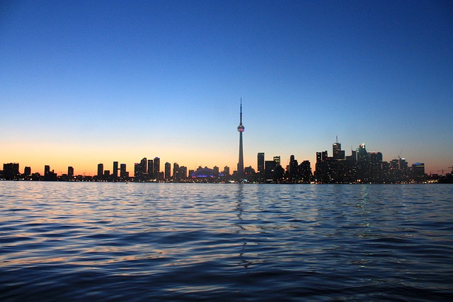 Toronto skyline at dusk used as a subtle background for a Canadian education brand